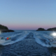 Front view of two small boats on water in the evening