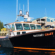 Side image of a boat with lights